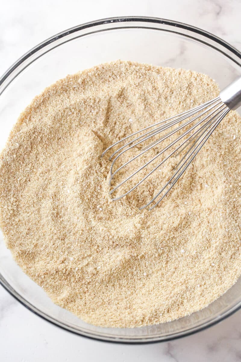 These customizable no-bake rum balls are a holiday must-have, perfect for gifting, gatherings, or adding to your festive cookie tray! Vanilla wafer crumbs, pecans, and powdered sugar pulsed into fine crumbs.