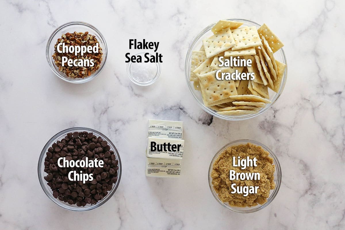 This saltine cracker toffee is rich, buttery, and full of crispy crackers. With a chocolate topping and crunchy pecans, it's a holiday must! Labeled ingredients for saltine cracker toffee recipe.