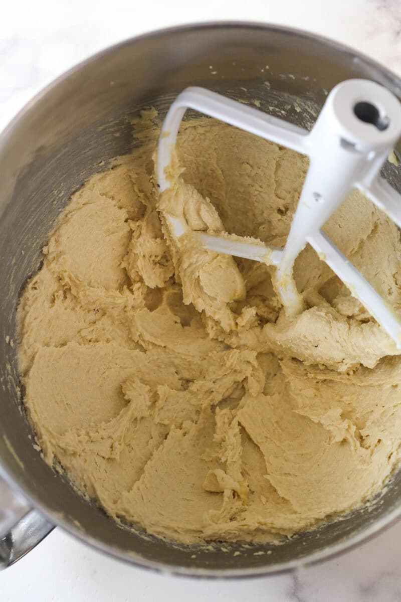 These decadent turtle thumbprint cookies feature a rich chocolate base, gooey caramel center, and crunchy pecan coating. Wow! Creaming together butter and sugars for cookie dough.