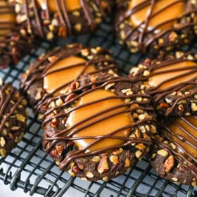 Turtle thumbprint cookie on a cooling rack.