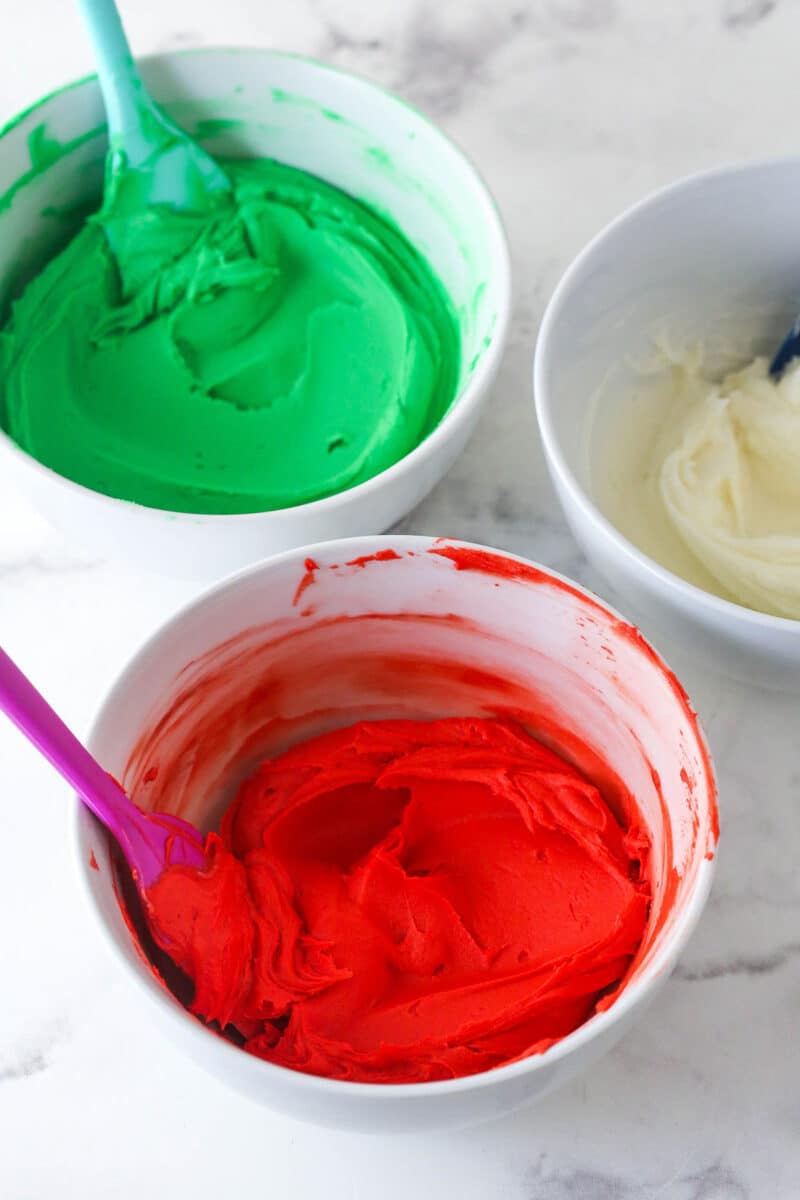 butter divided into three bowls and colored green, red and white