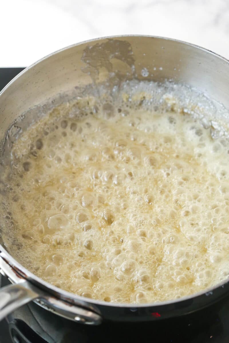 caramel ingredients boiling in saucepan