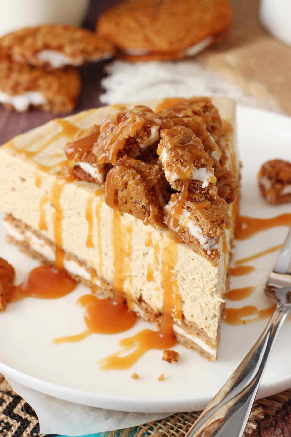 A slice of no bake oatmeal cream pie cheesecake on a white plate.