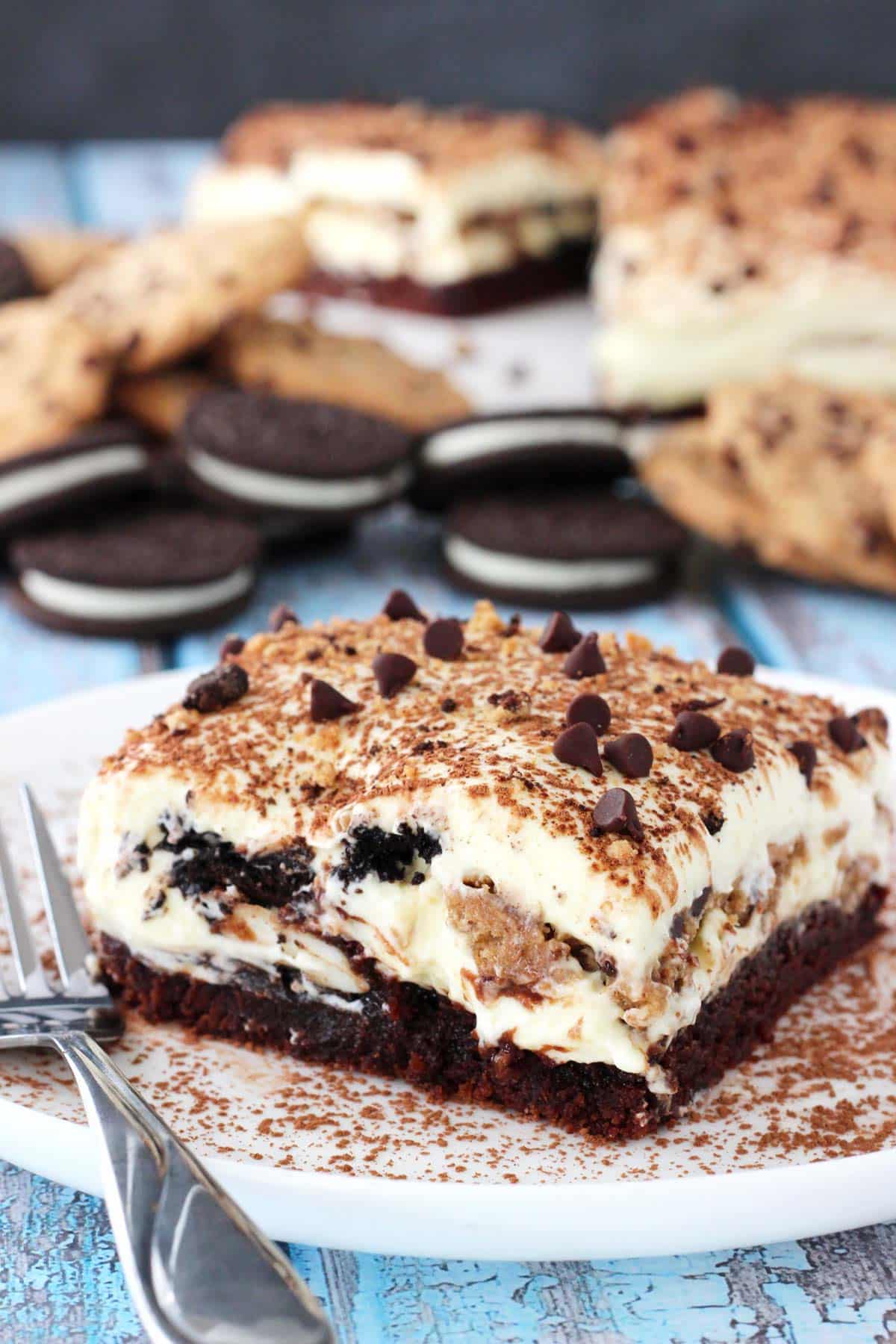 A slice of Oreo brookie tiramisu on a white plate.
