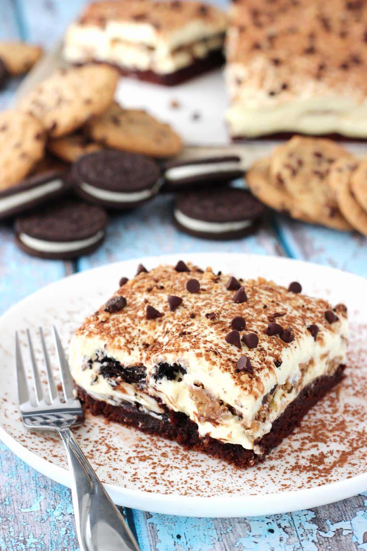 A slice of Oreo brookie tiramisu on a small white plate.