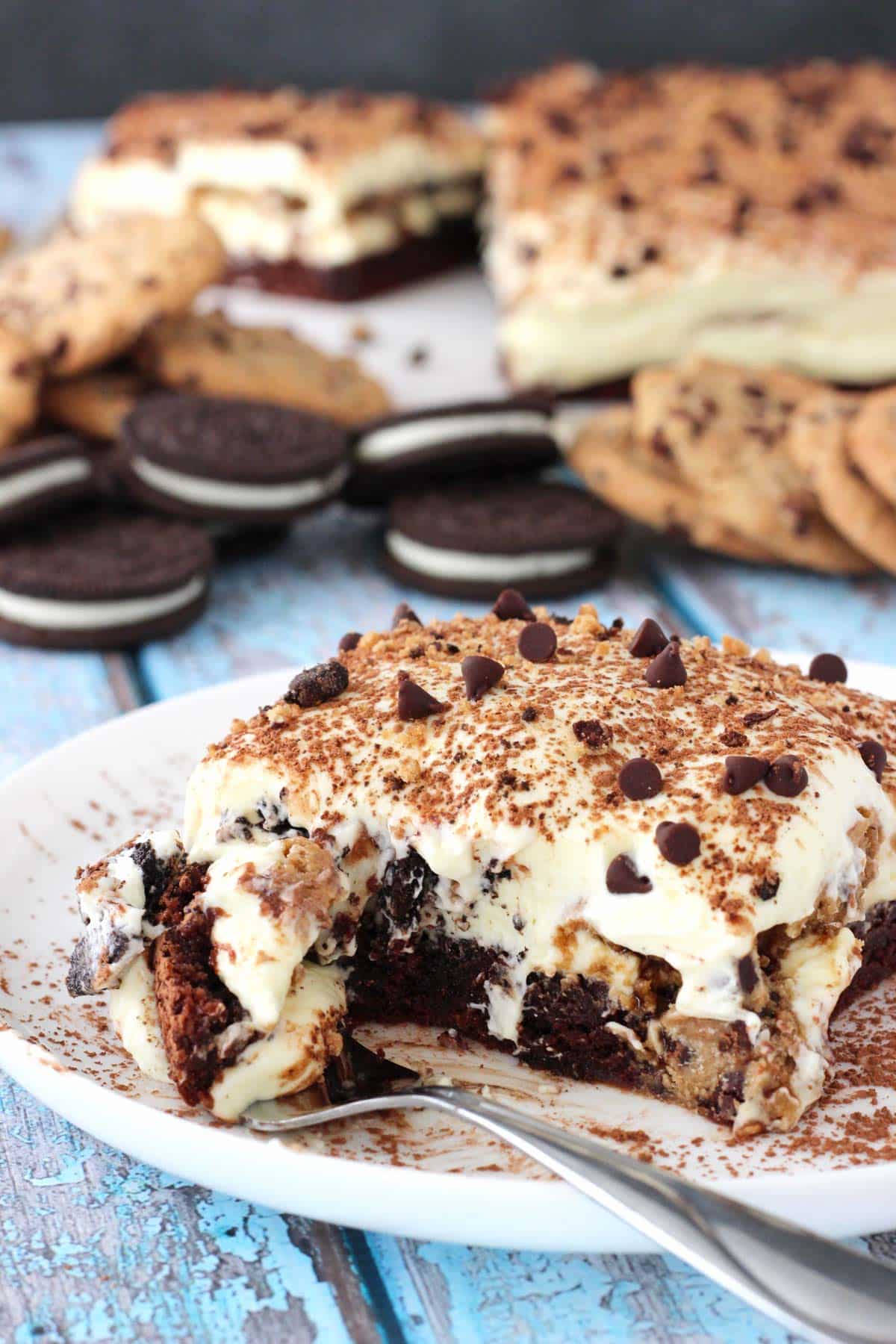 A slice of Oreo brookie tiramisu with a bite removed on a fork.