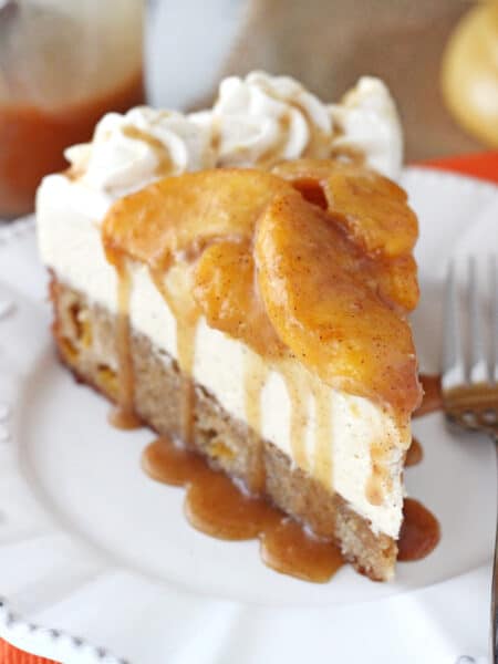 A slice of peach caramel blondie cheesecake on a white plate.