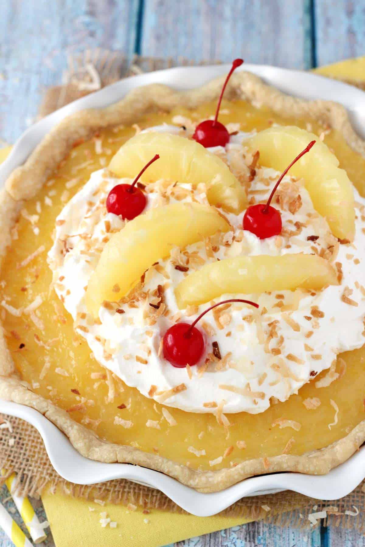 Close up of a pina colada pie in a white pie plate.