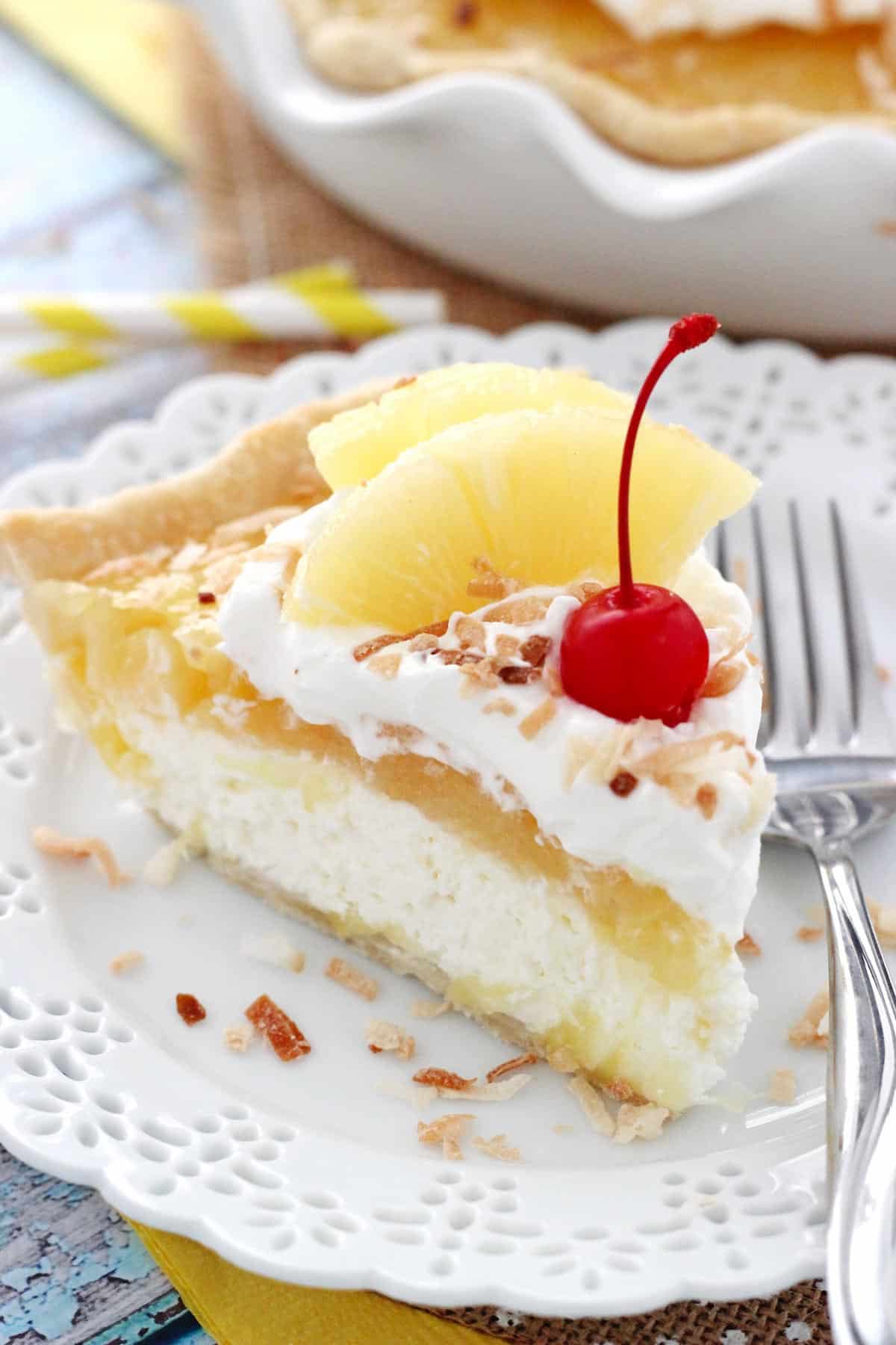 A slice of pina colada pie on a white plate.