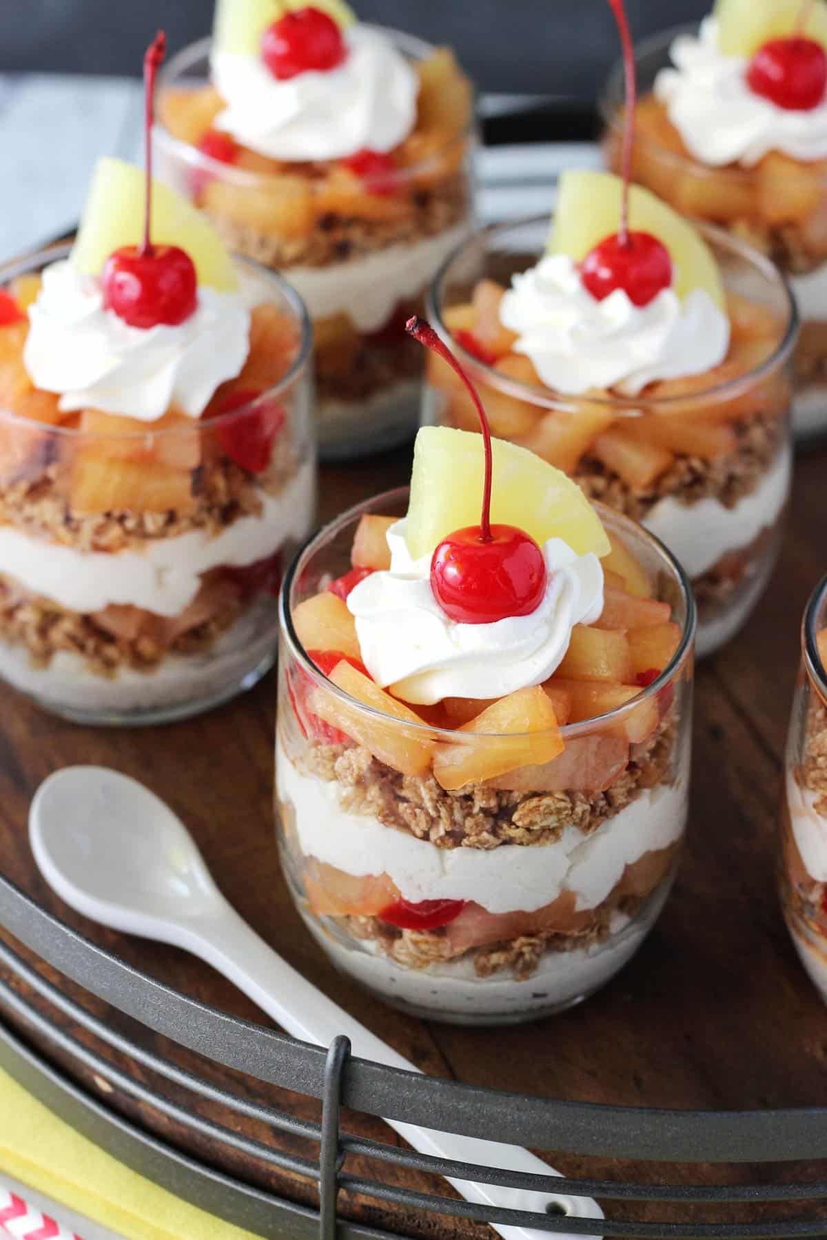 Overhead view of Pineapple Upside Down Trifles on a wooden tray.