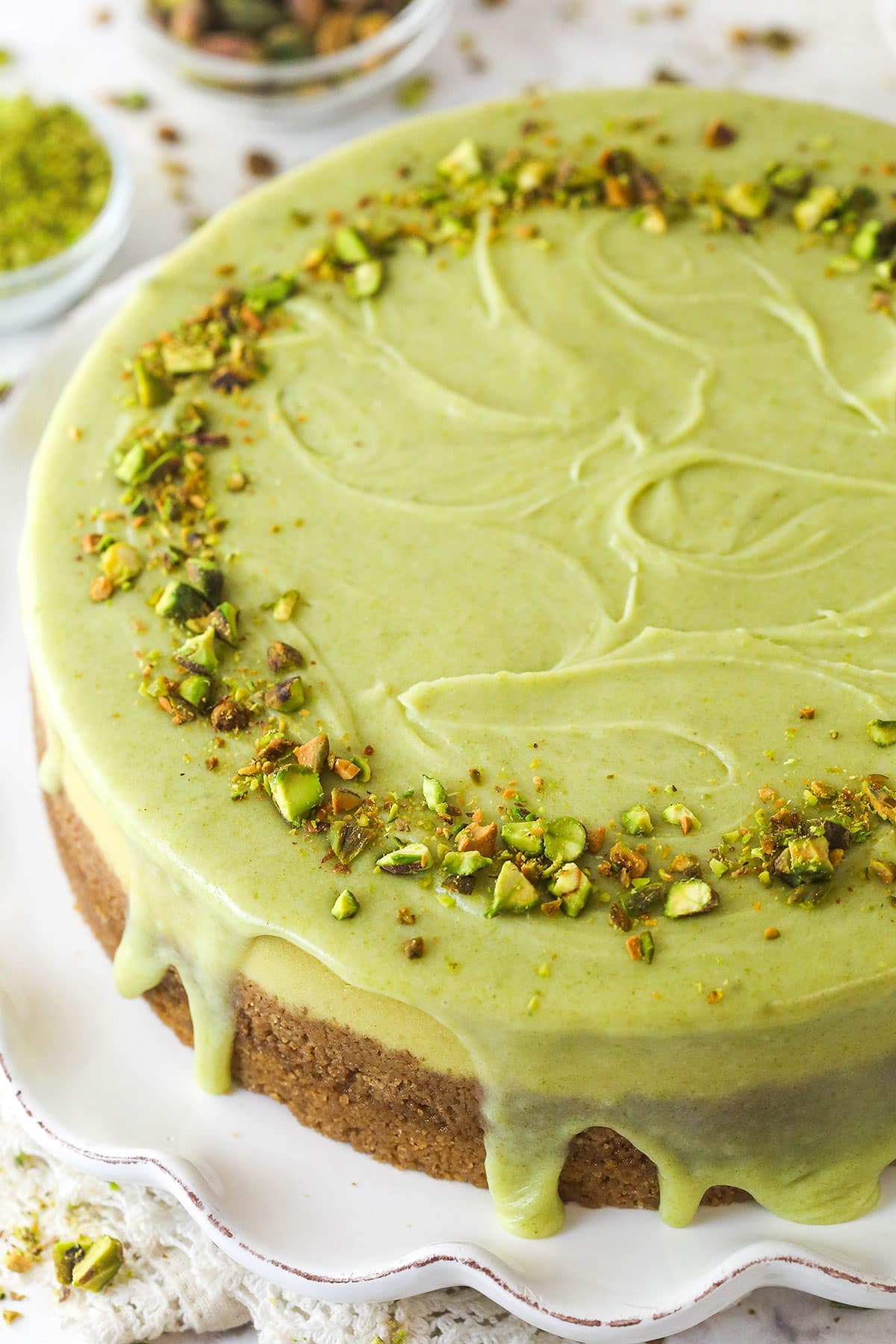 pistachio cheesecake on white platter