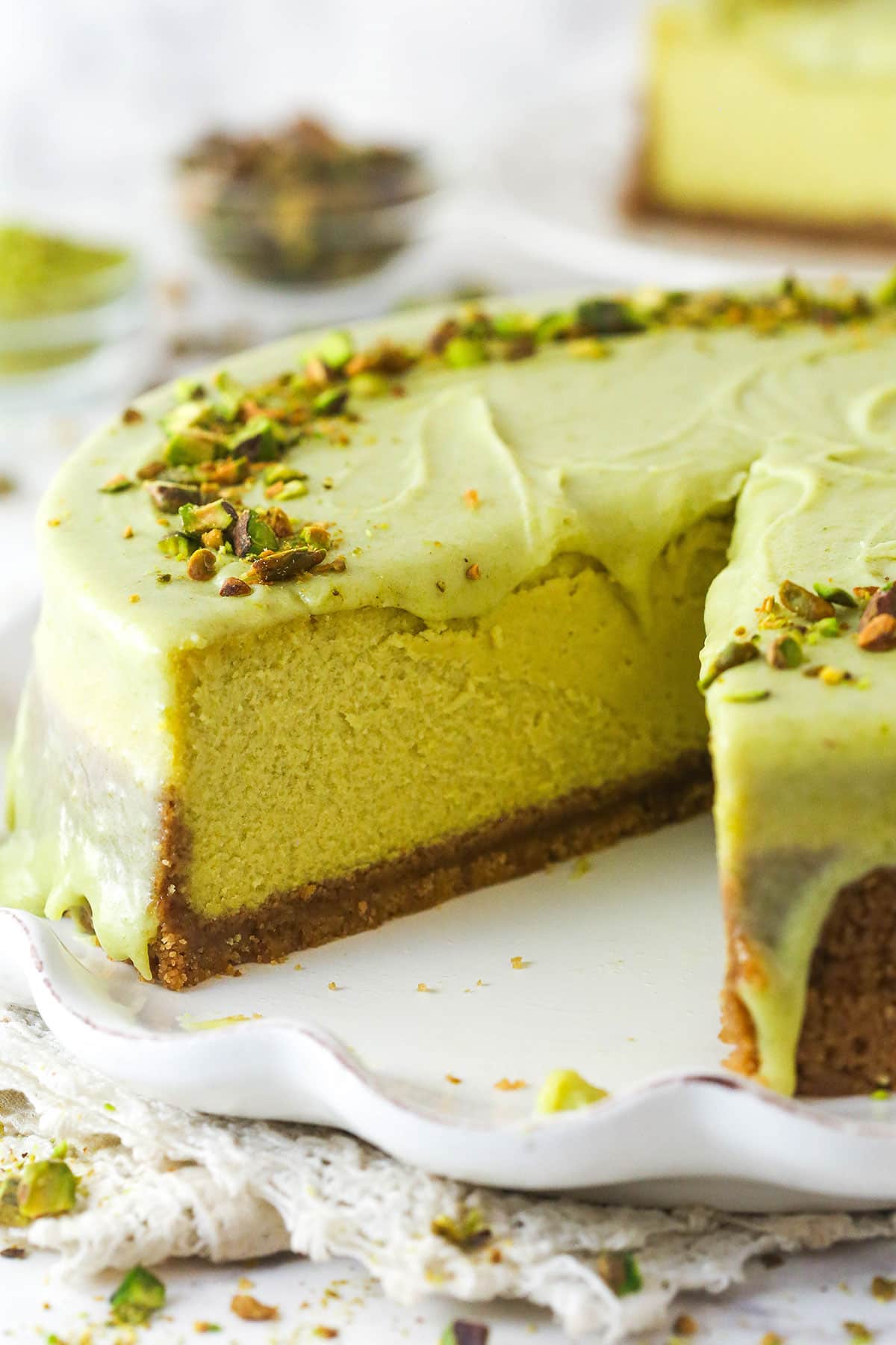 pistachio cheesecake with slice removed