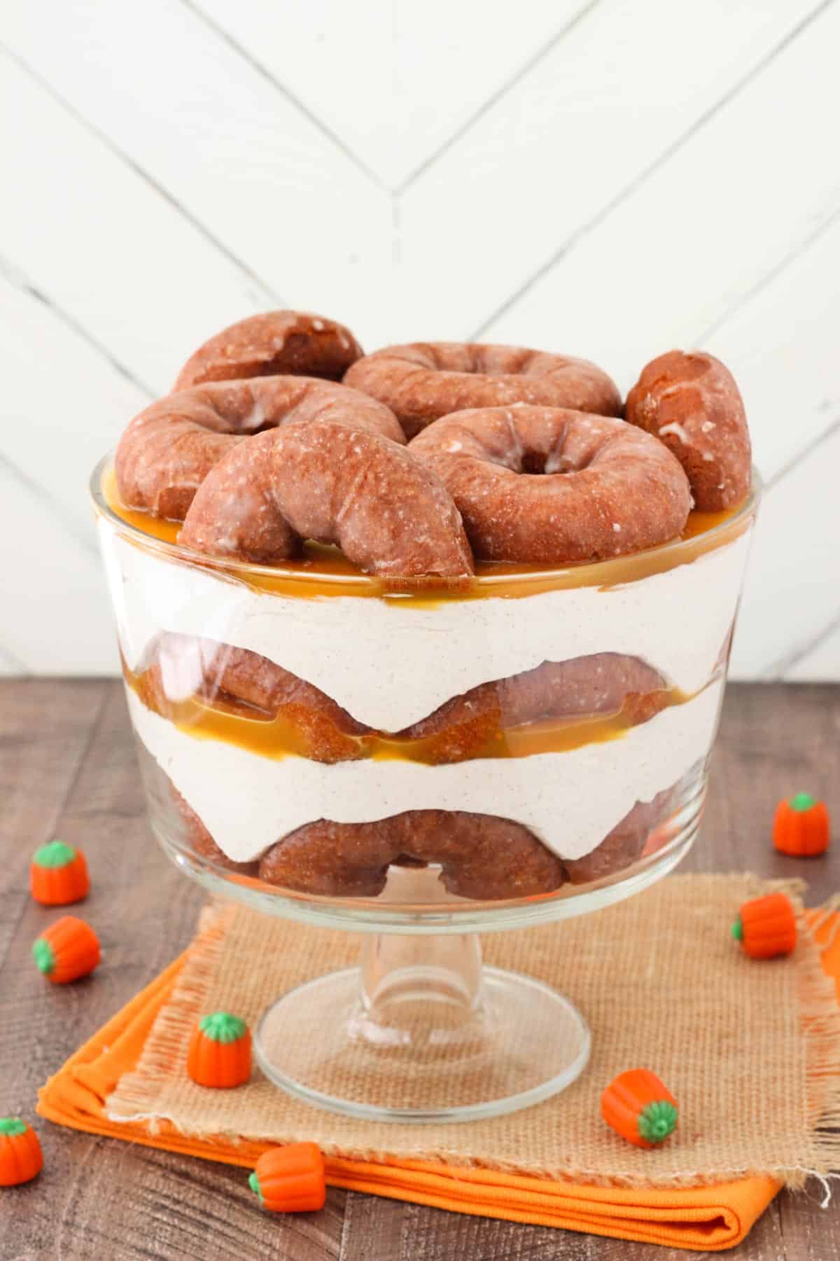 Side view of a pumpkin spice donut cheesecake trifle.