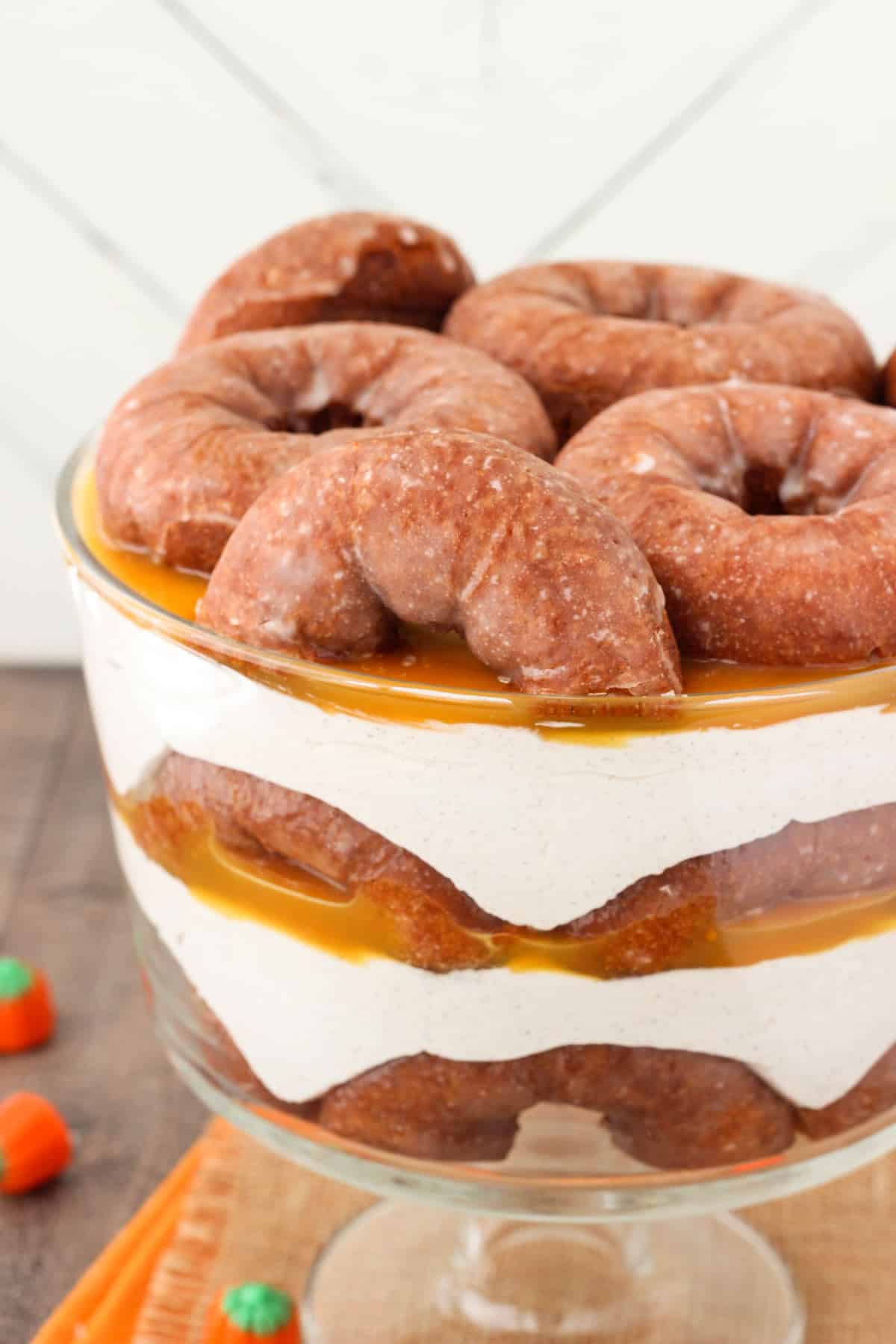 Close up of the side of a pumpkin spice donut cheesecake trifle.
