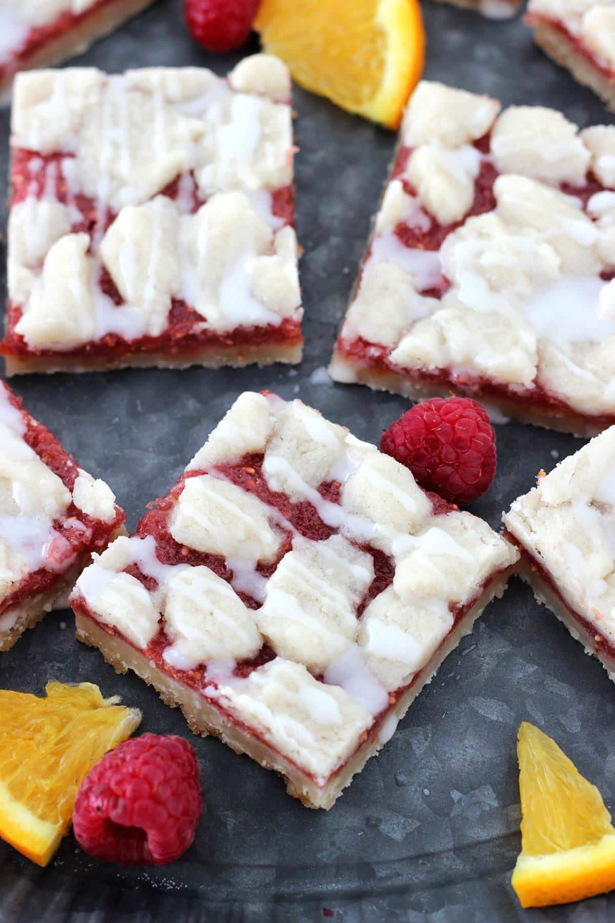 Close up of a couple of raspberry orange shortbread bars