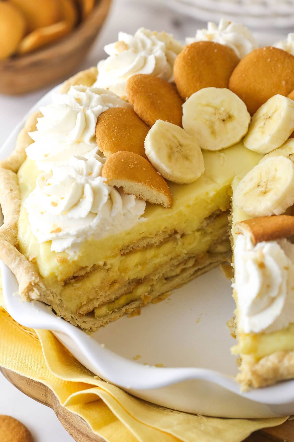 Banana pudding pie with a slice missing to show the layers