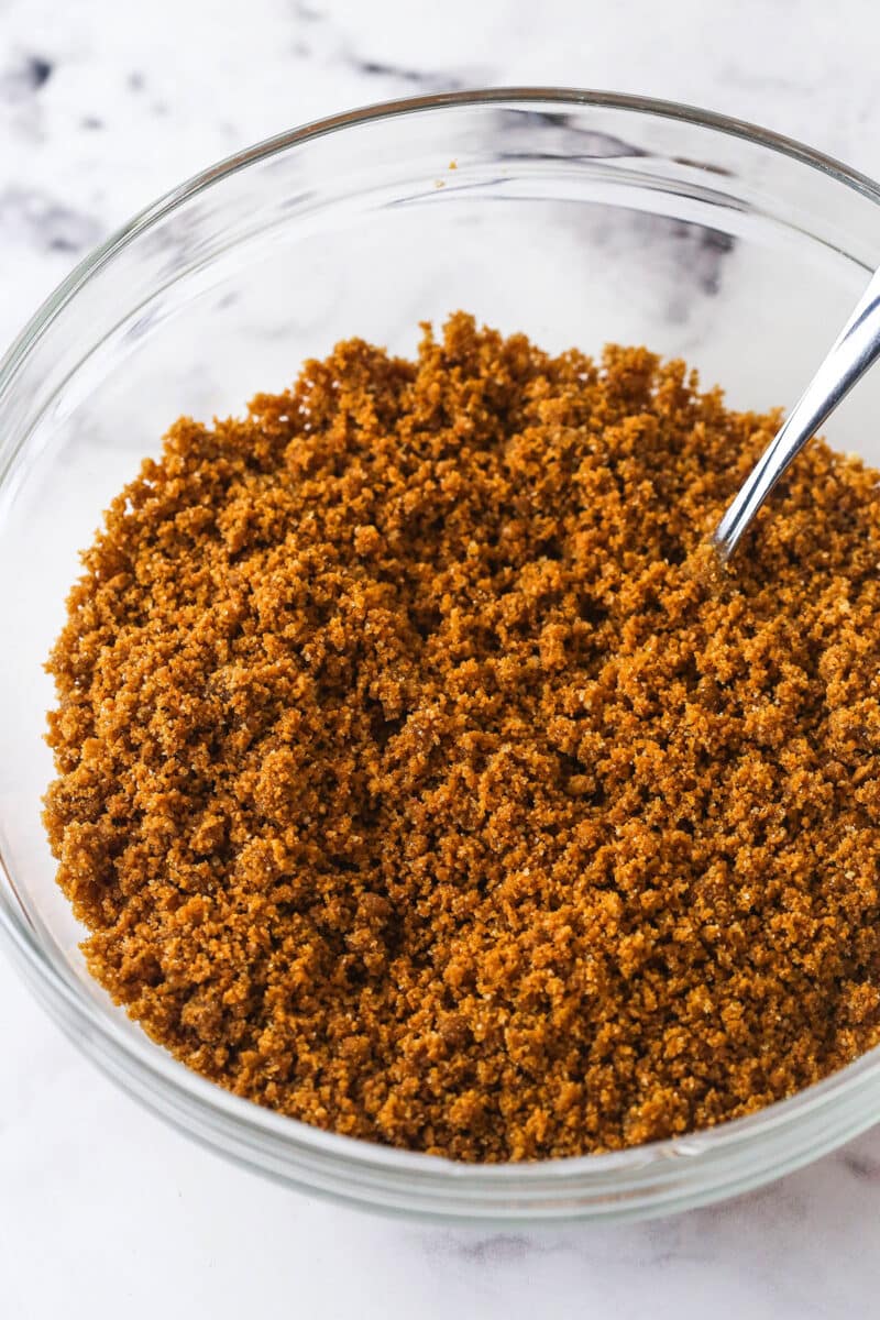 With a Biscoff cookie crust and cookie spread in the filling, this Biscoff Cheesecake tastes just like the cookies. Biscoff cookie crumbs mixed with butter and brown sugar