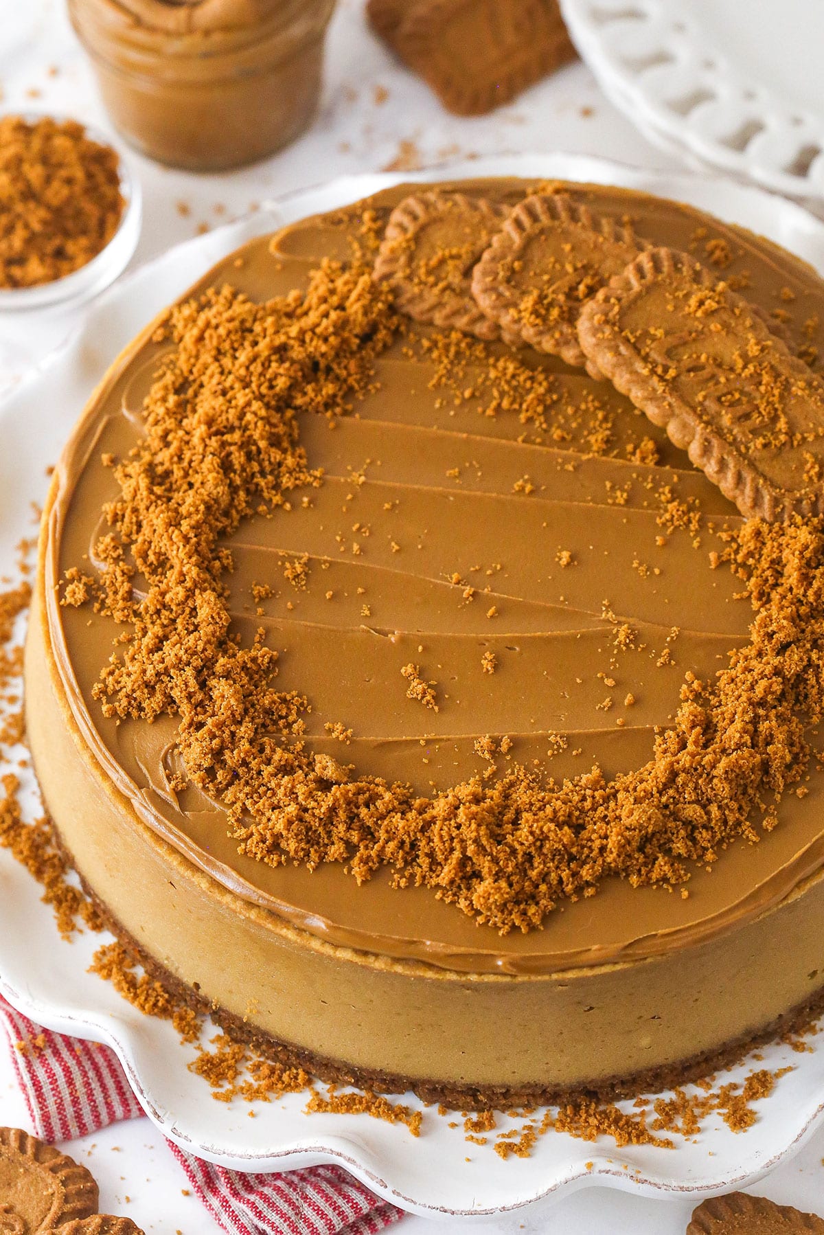 With a Biscoff cookie crust and cookie spread in the filling, this Biscoff Cheesecake tastes just like the cookies. Overhead view of a biscoff cheesecake