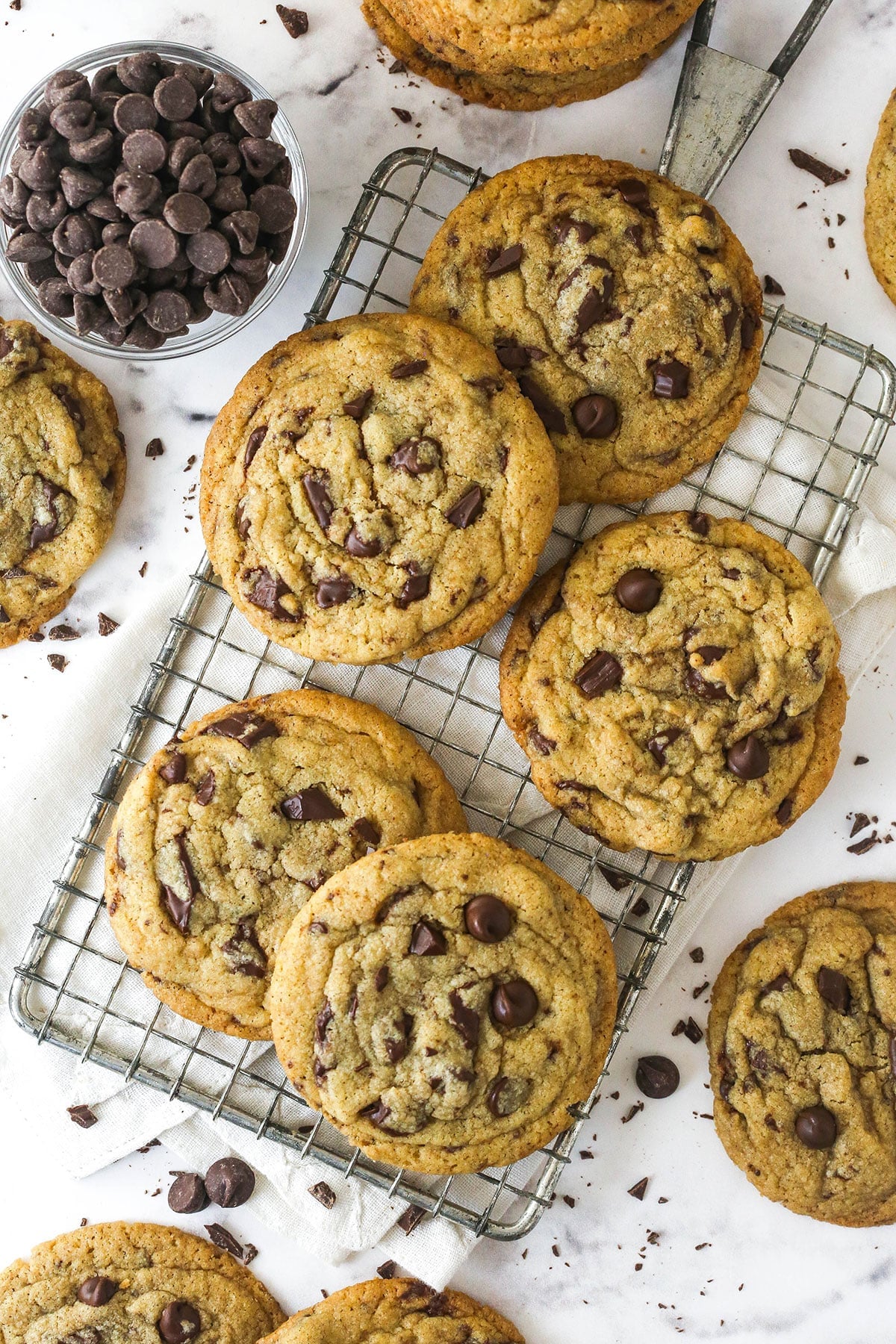 These Brown Butter Chocolate Chip Cookies take classic chocolate chip cookies to a whole new level, with a rich and slightly nutty flavor. Overhead view of brown butter chocolate chip cookies on a cooling rack