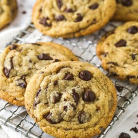 Angled view of brown butter chocolate chip cookies on a cooling rack
