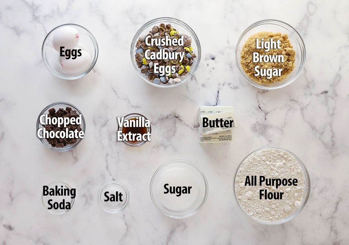 Every bite of these soft and chewy Cadbury egg cookies is dotted with crushed Cadbury eggs and chocolate. Perfect for spring & Easter! Labeled ingredients needed to make Cadbury egg cookies