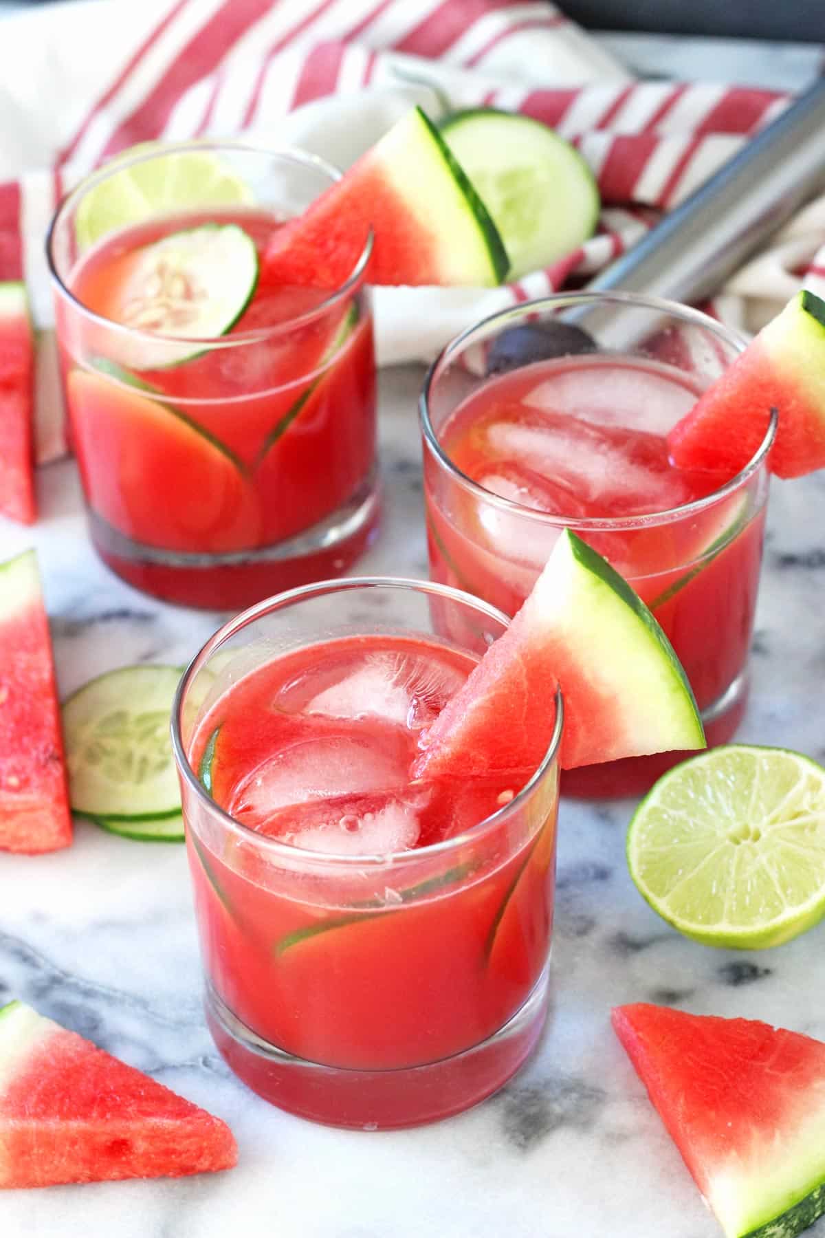 Overhead view of watermelon elderflower cocktails in small round glasses.