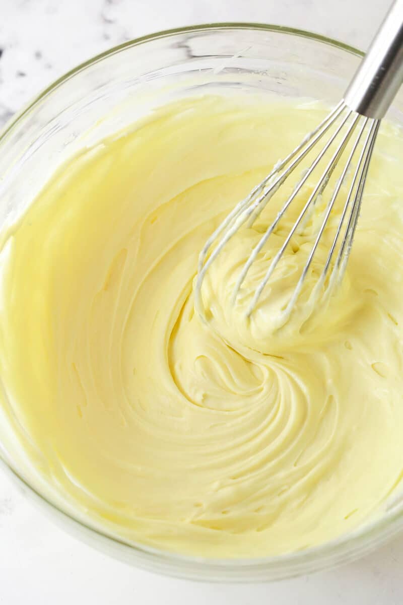 These Black Bottom Cupcakes combine two desserts in one with a rich chocolate cupcake and a creamy chocolate chip cheesecake filling. Whisking cream cheese filling ingredients together