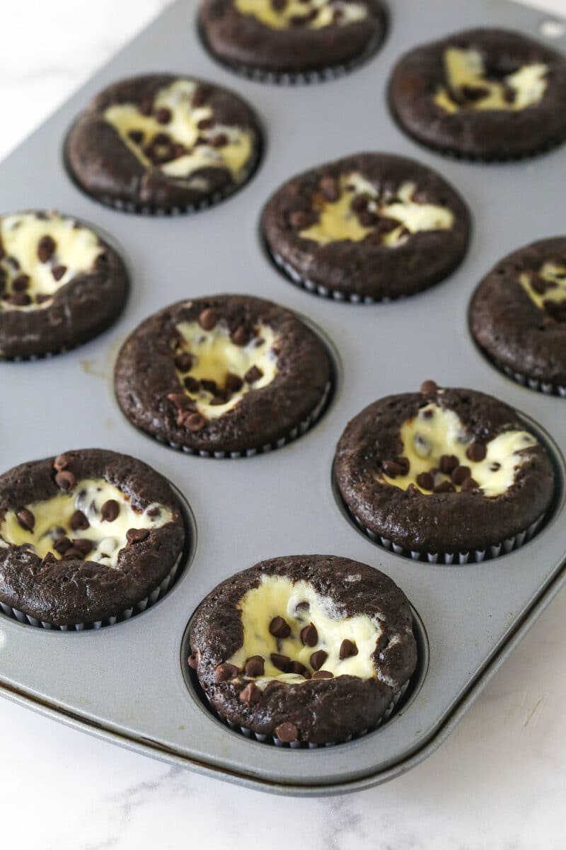 These Black Bottom Cupcakes combine two desserts in one with a rich chocolate cupcake and a creamy chocolate chip cheesecake filling. Black bottom cupcakes in a cupcake pan