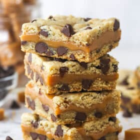 A stack of four caramel cookie bars