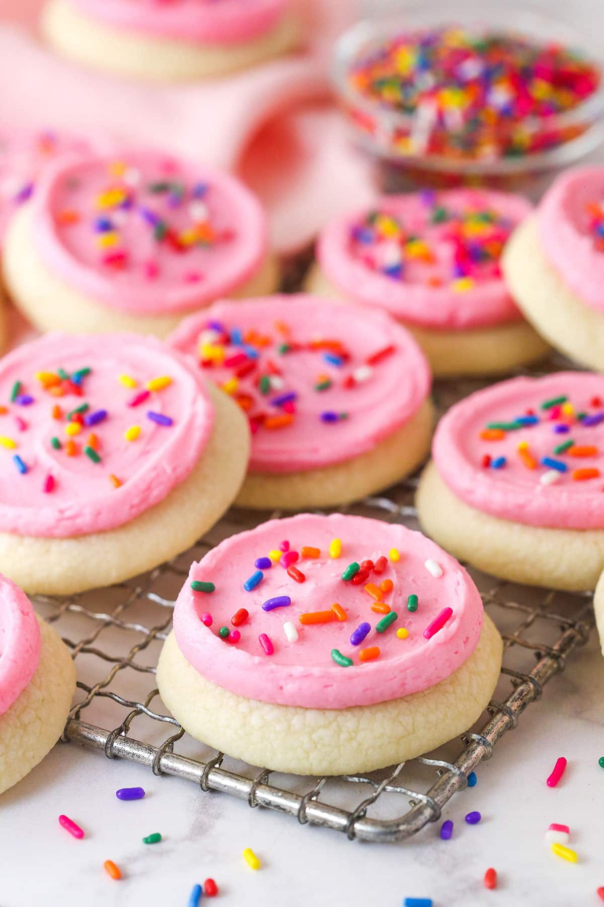 These copycat Lofthouse Cookies are soft and cakey with a melt-in-your-mouth texture and light flavor, just like the ones at the supermarket. Lofthouse cookies on a wire rack