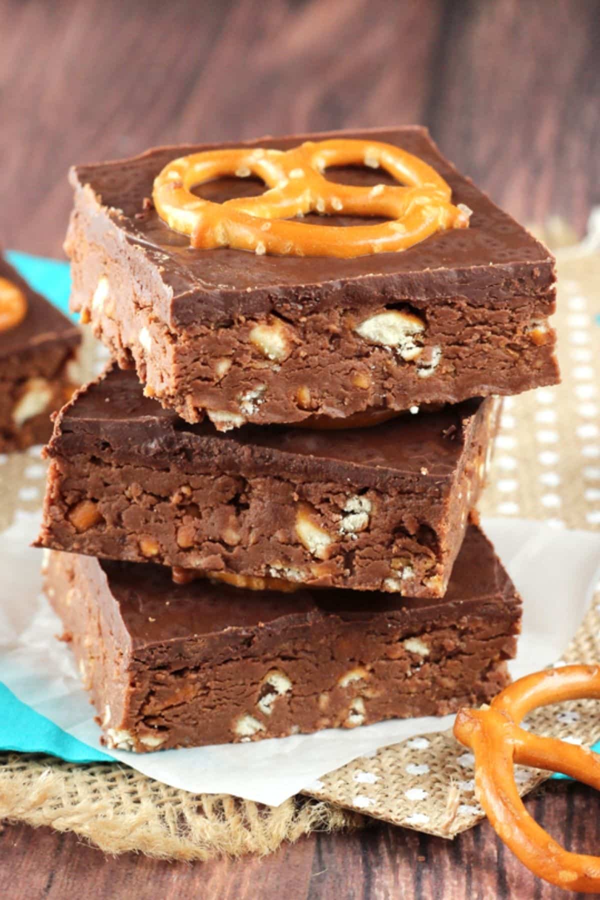 Close up of three no bake Nutella pretzel bars stacked one on top of the other.
