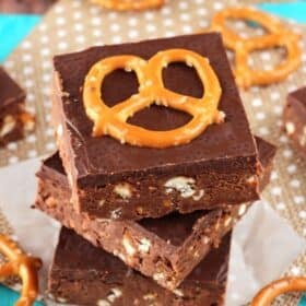 Close up of the top of three no bake Nutella pretzel bars stacked one on top of the other.