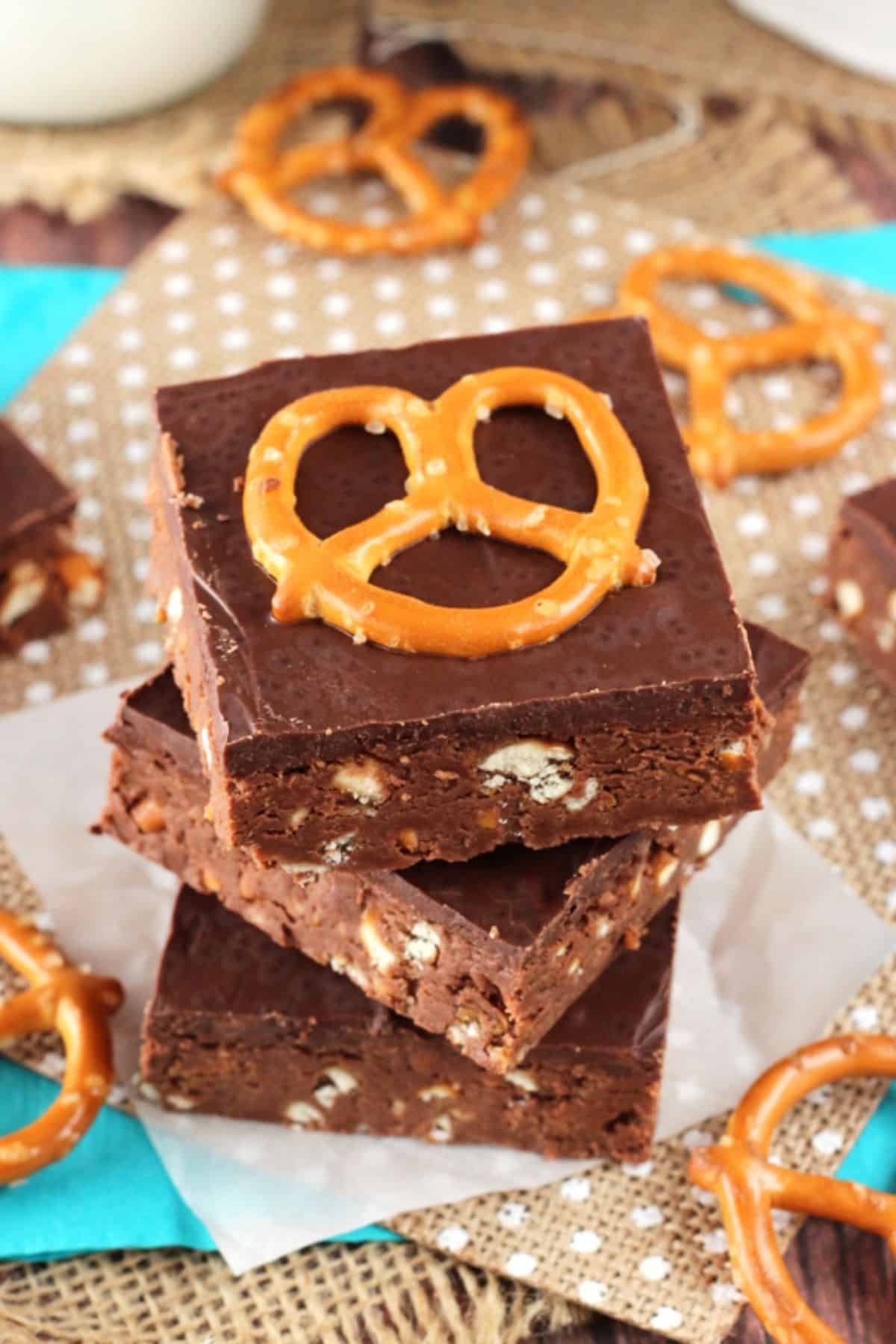 Close up of the top of three no bake Nutella pretzel bars stacked one on top of the other.