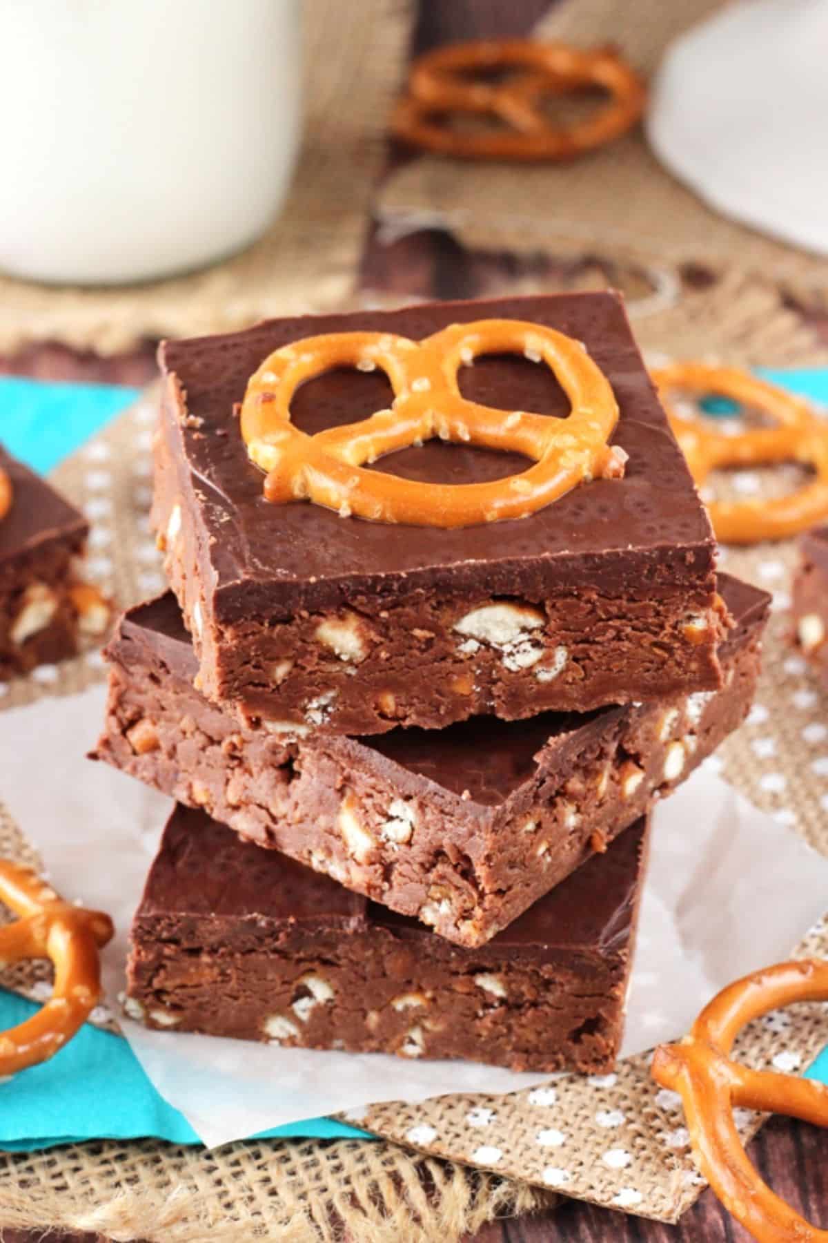 Close up of the top of three no bake Nutella pretzel bars stacked one on top of the other.
