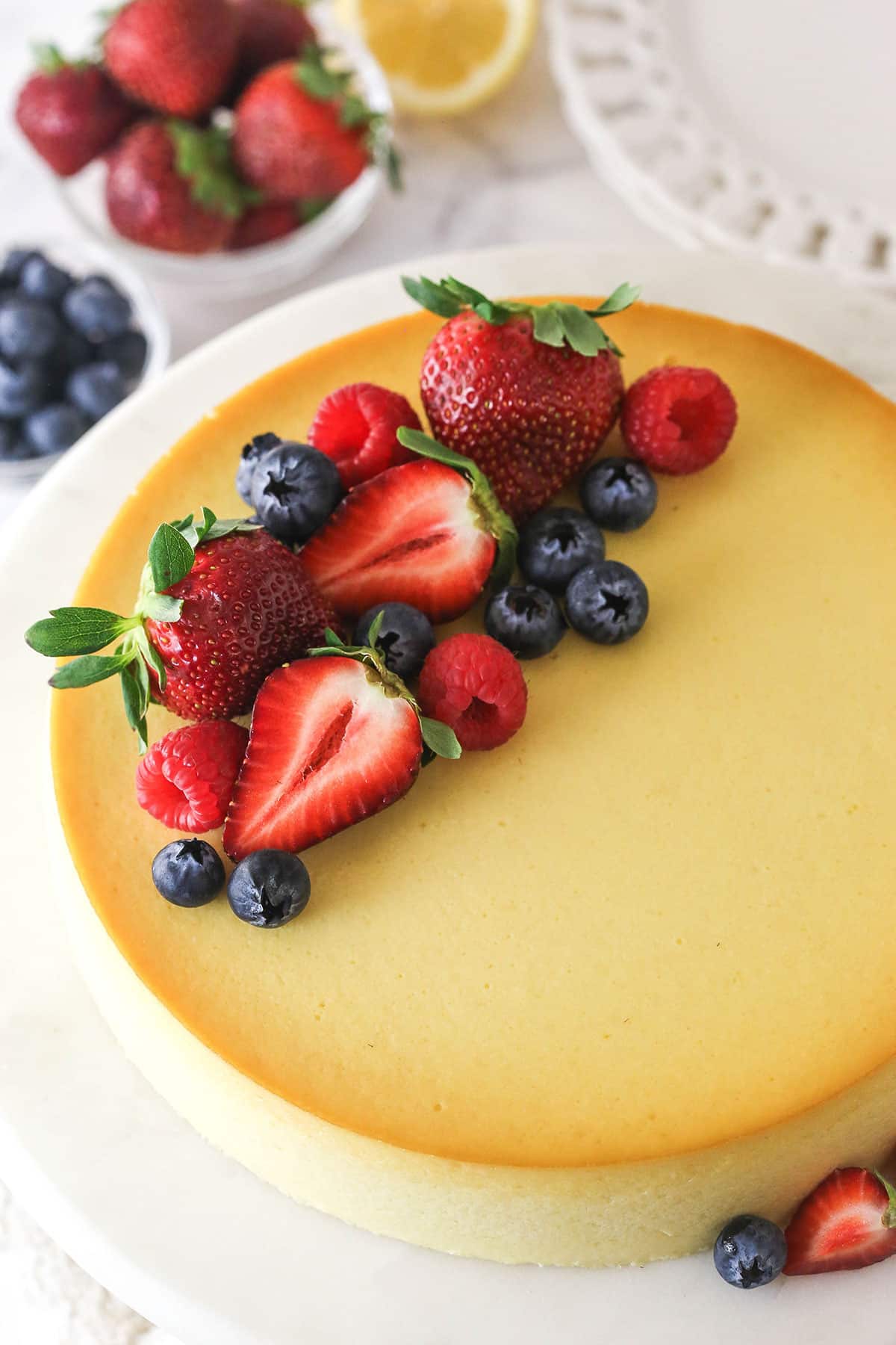 Overhead view of ricotta cheesecake topped with fresh fruit