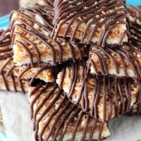 Top view of a pile of cut Samoa Cookie Bars.