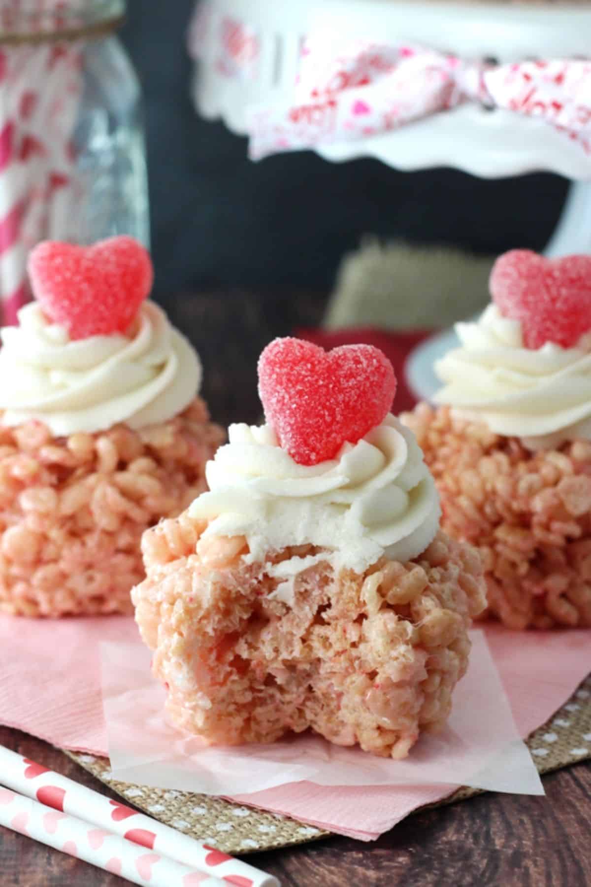 Close up of a Valentine's Day rice krispie treat with a bite taken out of it.