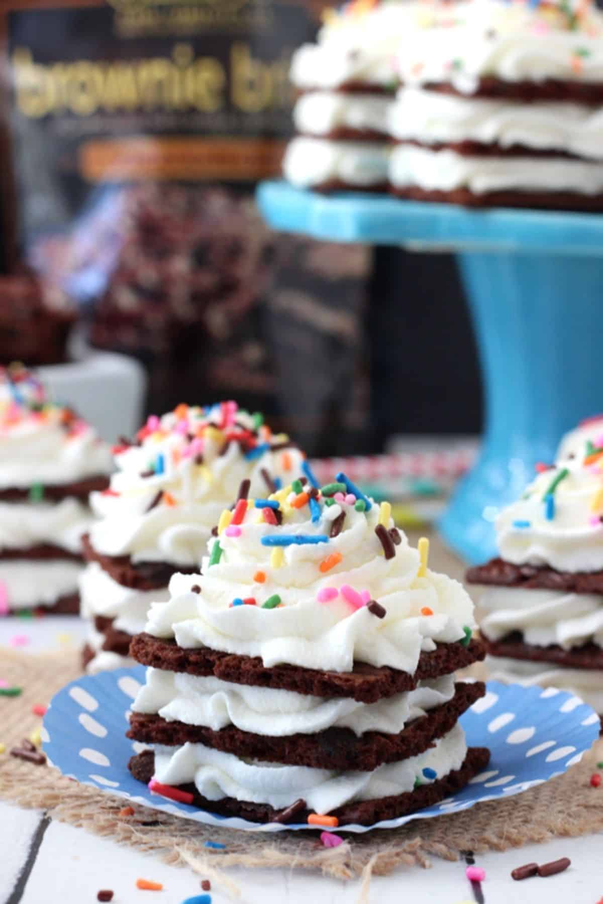 Close up of a Brownie Brittle icebox cupcake with more cupcakes in the background.