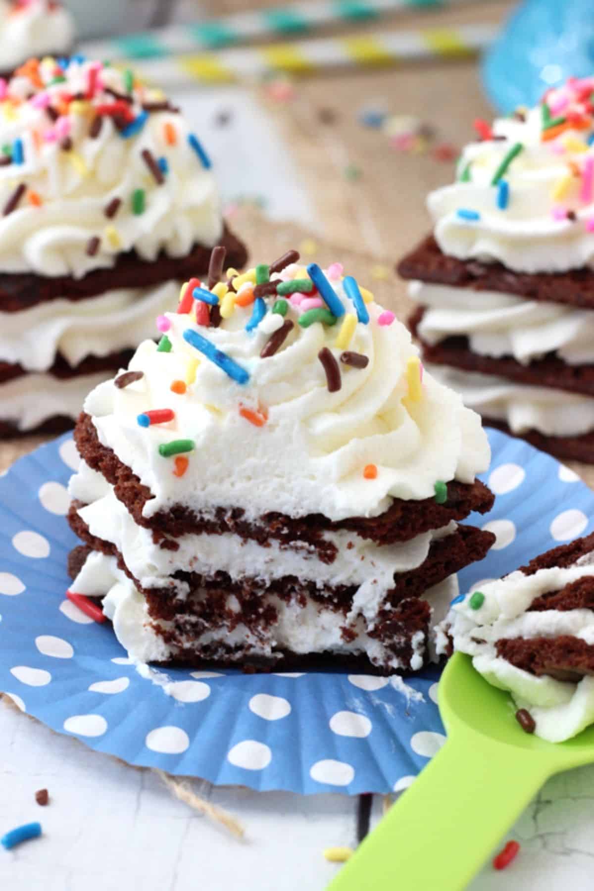 Close up of a Brownie Brittle icebox cupcake with a few bites removed on a spoon.