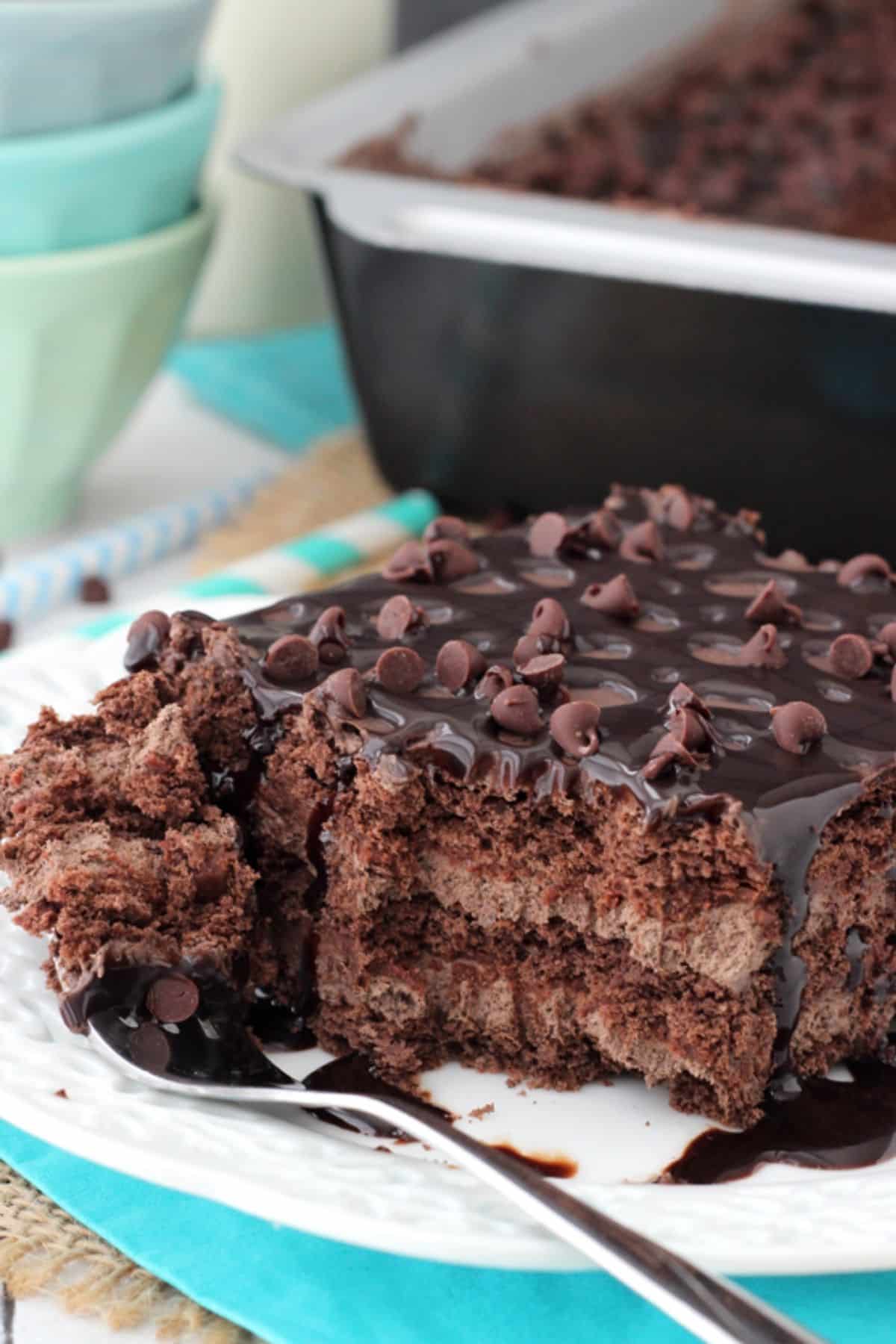 Death by Chocolate Icebox Cake Close up of a slice of death by chocolate icebox cake with a bite removed on a fork.