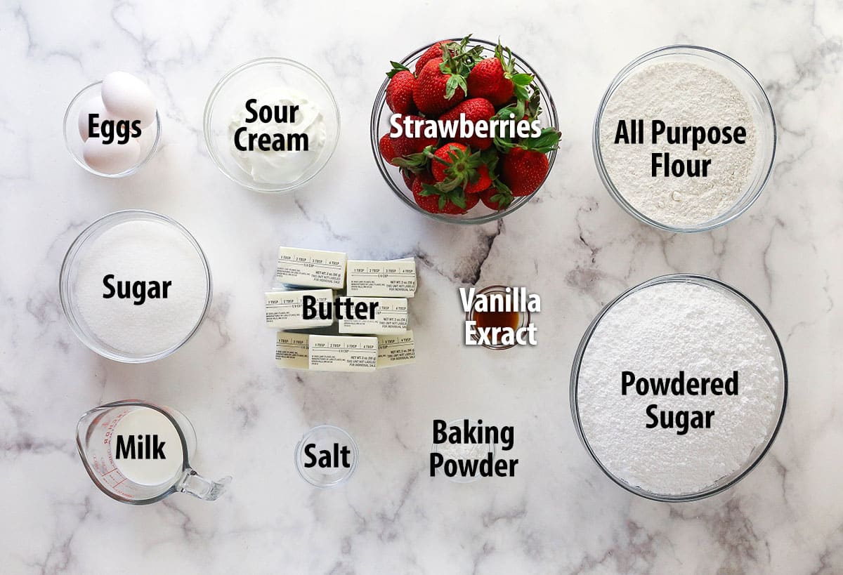 Overhead view of ingredients needed to make fresh strawberry cake