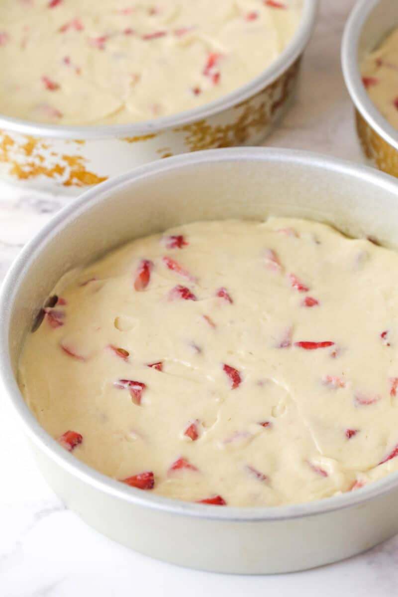 Strawberry cake batter in a round pan