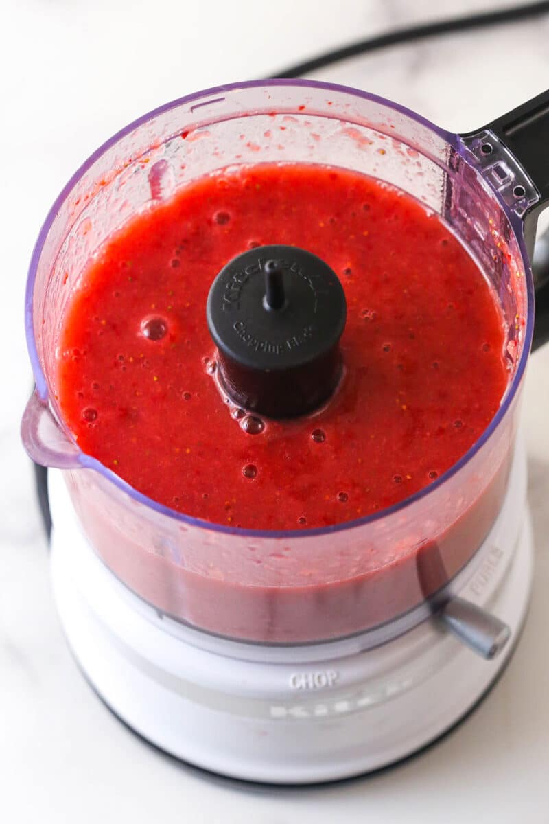 Pureed fresh strawberries in a mixing bowl