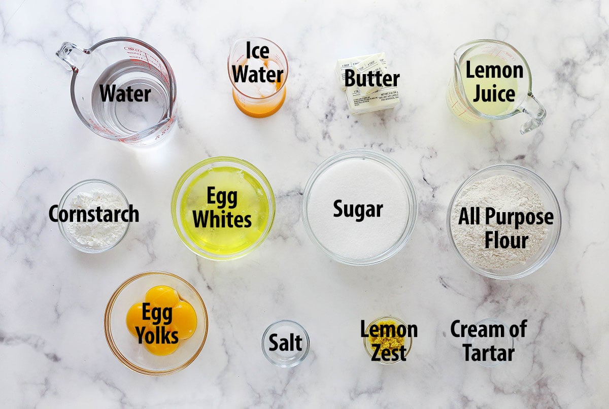 This classic lemon meringue pie features a tart lemon filling in a buttery crust topped with a light but stable meringue. Overhead view of ingredients needed to make lemon meringue pie
