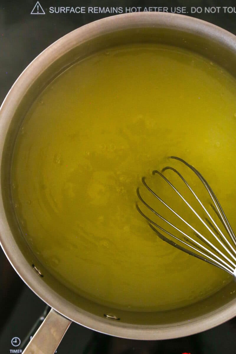 Whisking lemon filling in a pan