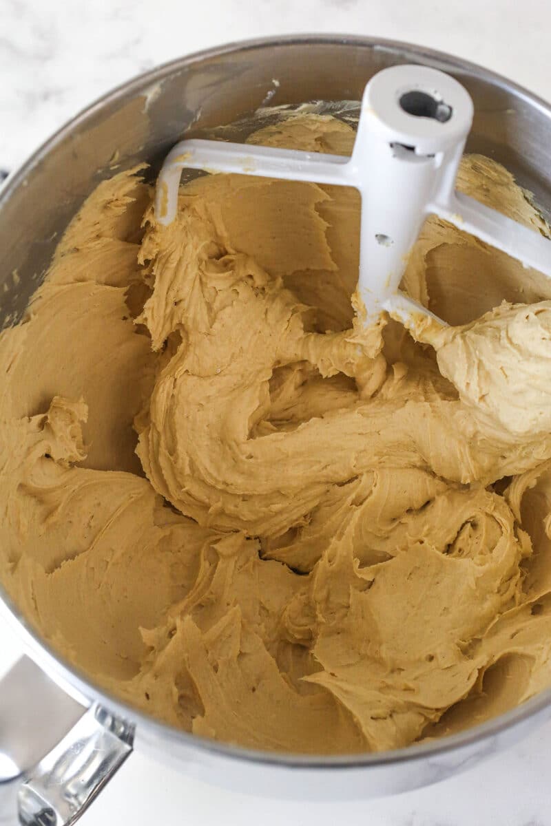 These peanut butter chocolate cupcakes are all about the classic flavor combo, with peanut butter buttercream on moist cupcakes. Peanut butter buttercream in a mixing bowl