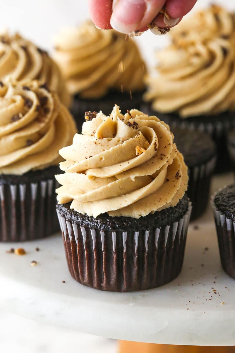 These peanut butter chocolate cupcakes are all about the classic flavor combo, with peanut butter buttercream on moist cupcakes. Sprinkling crushed peanuts on top of peanut butter chocolate cupcakes