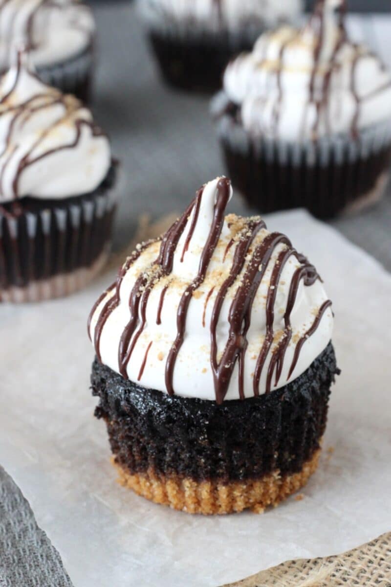 Close up of a S'mores Cupcake on a piece of parchment paper.