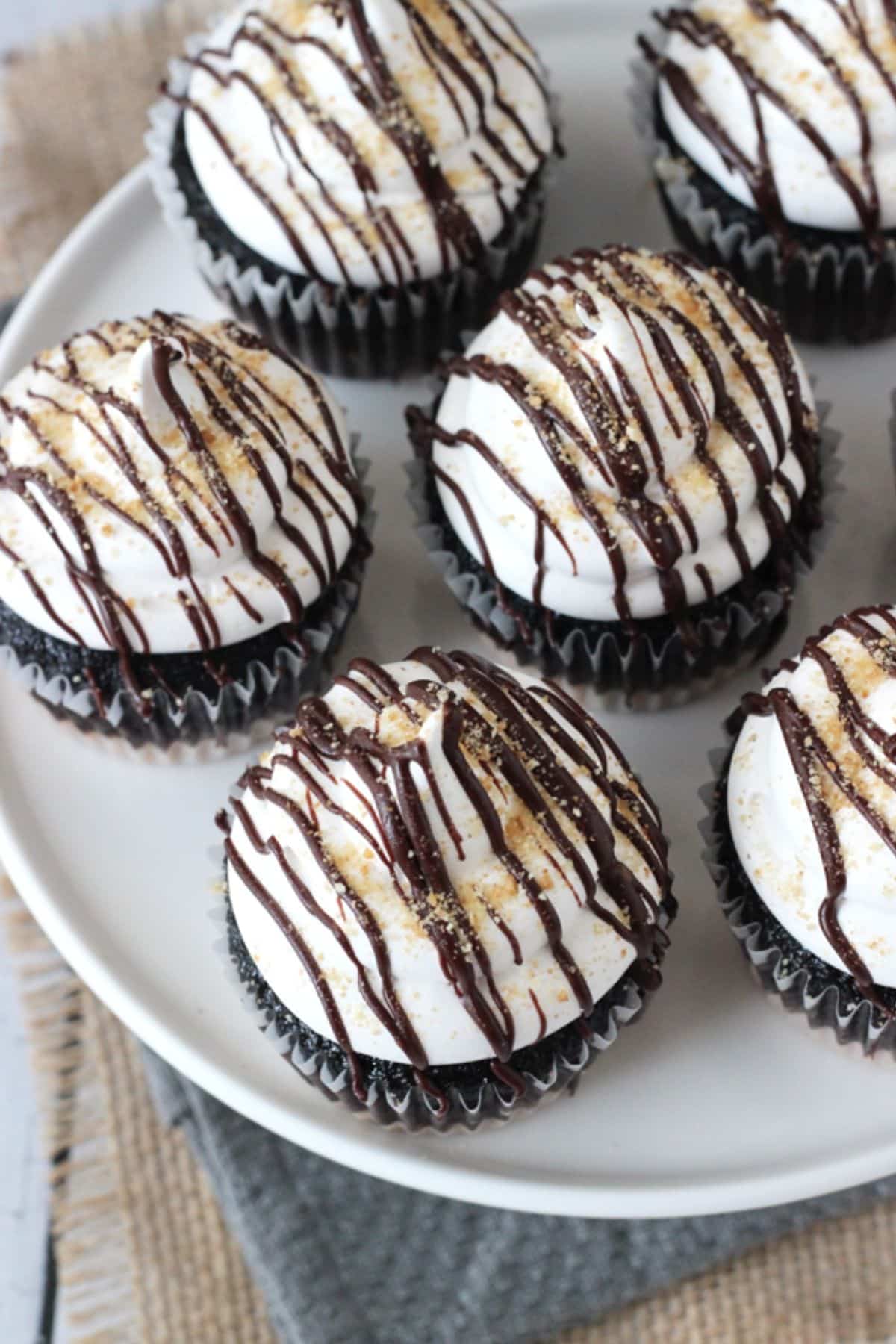 Top view of S'mores Cupcakes on a white plate.