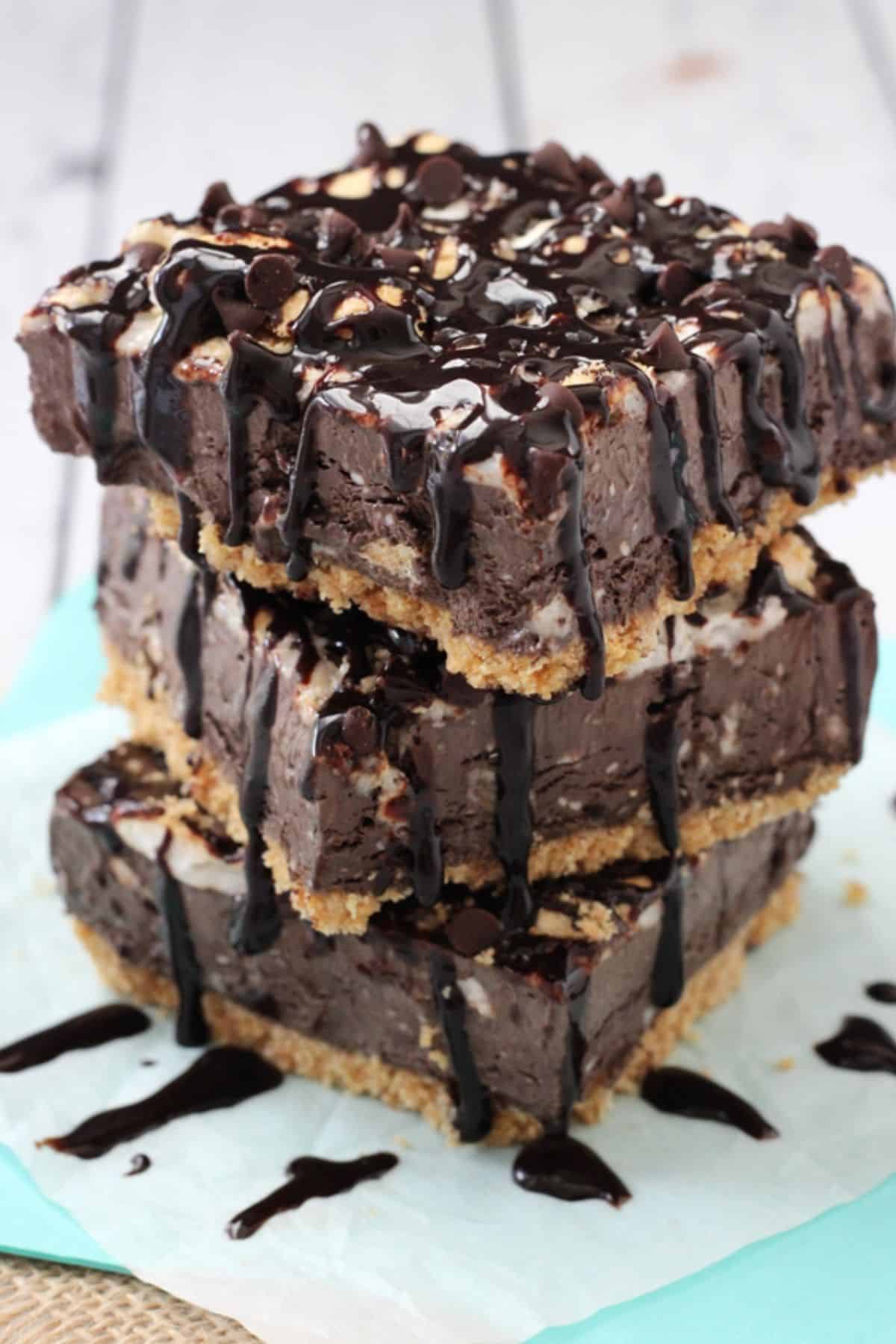 A stack of three s'mores ice cream bars stacked one on top of the other.